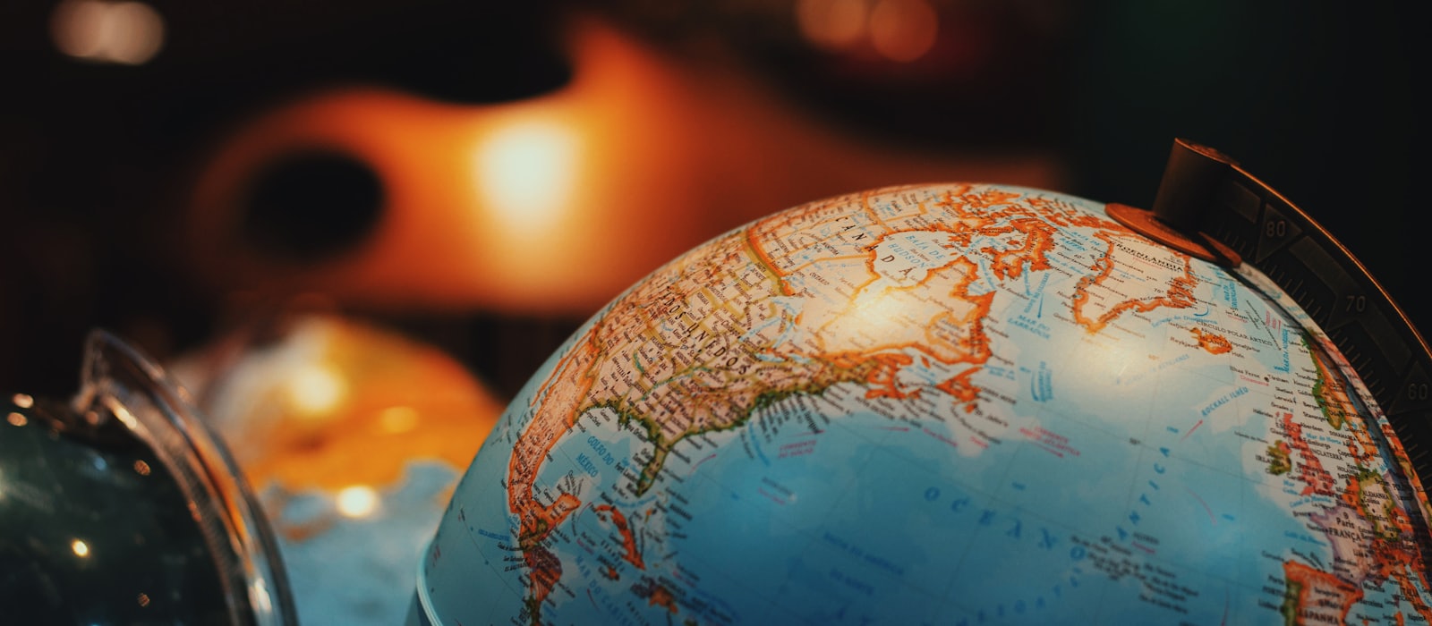 An illuminated desk globe showing North America and the Atlantic