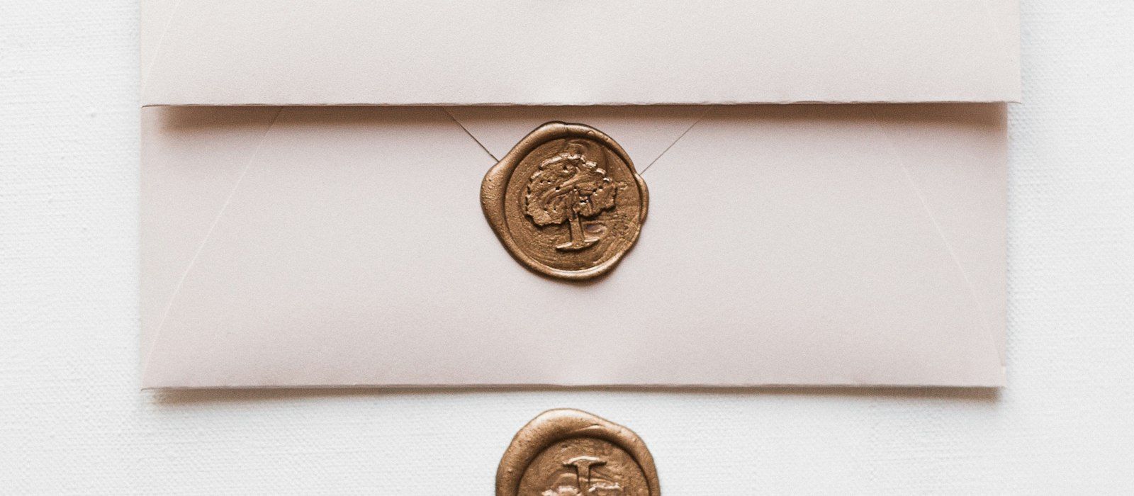 Pale envelopes closed with bronze wax seals