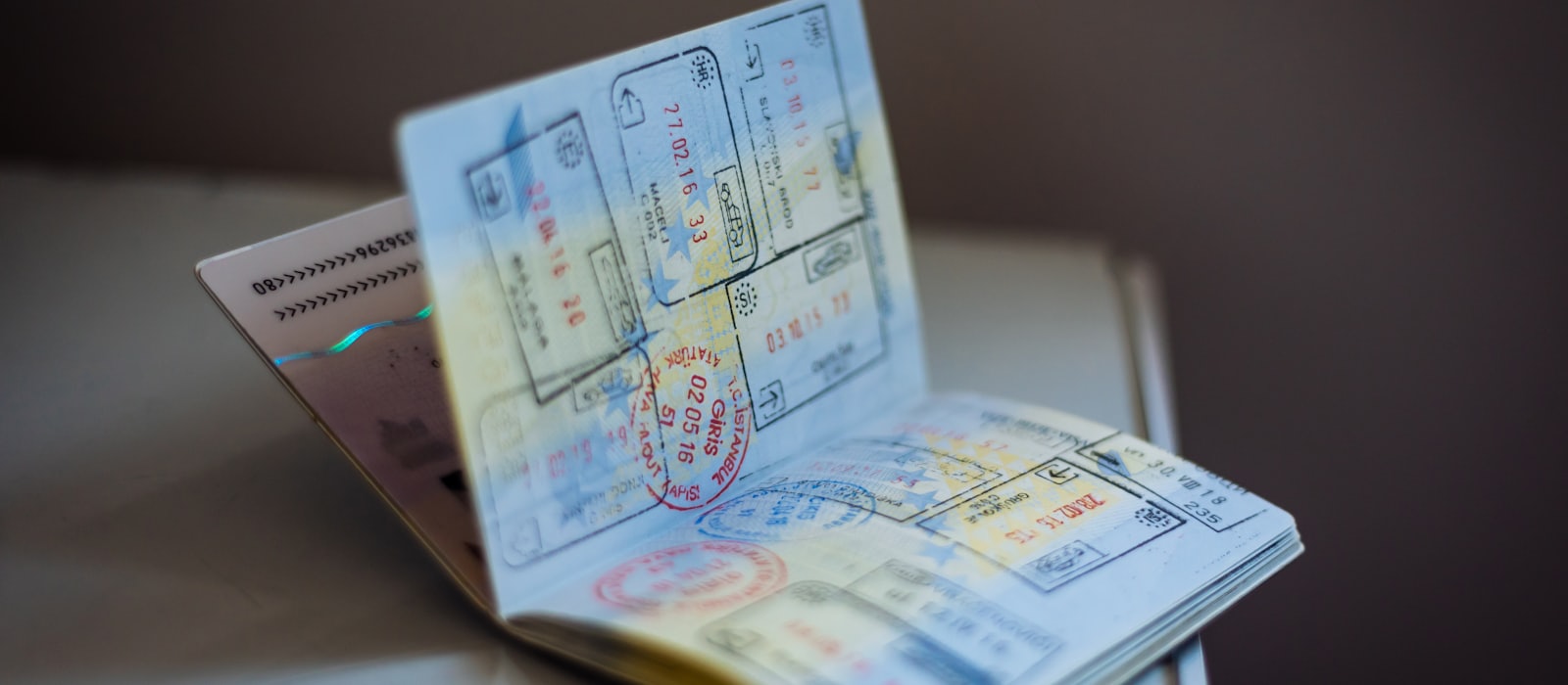 An open passport showing pages covered in entry and exit stamps