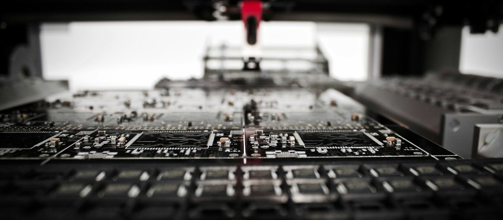 A robotic placement machine working above a printed circuit board