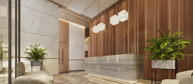 A quiet office lobby with a stone reception desk